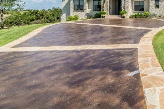 Elegant paver driveway leading to a house, illustrating professional driveway paving services.