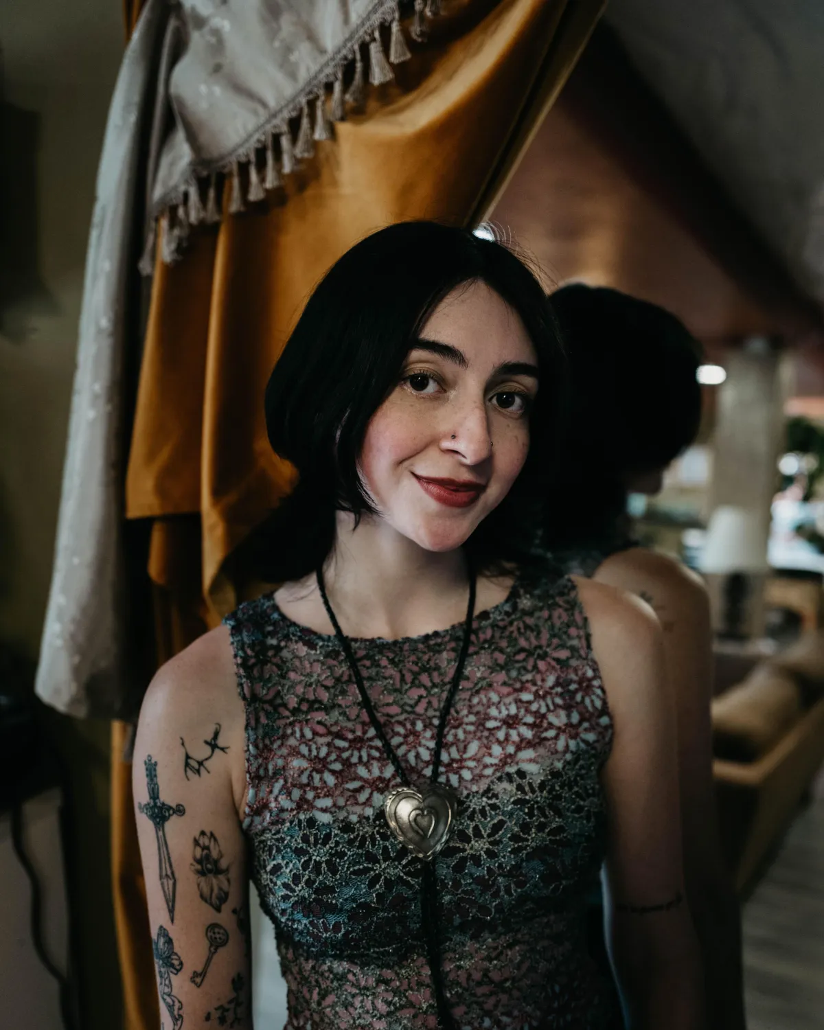 Portrait photo of Bella, tattoo artist behind IKAM INKS