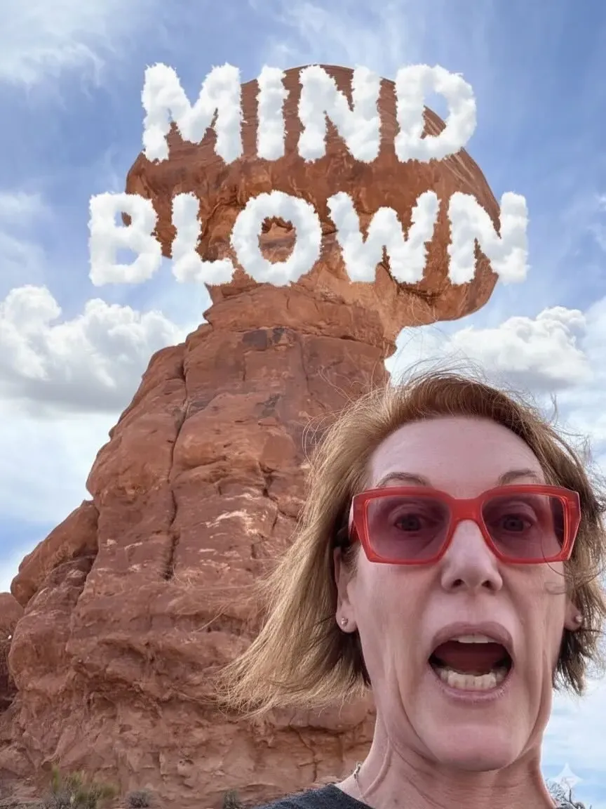 Tracey Bauer surprised with ‘Mind Blown’ text in sky.