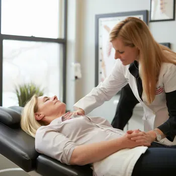 Minimalist icon representing 'Chronic Pain Management,' depicting a person holding their back in pain, surrounded by radiating lines to symbolize chronic discomfort. The icon is black on a white background, illustrating the chronic pain management services at Back in Action Chiropractic.