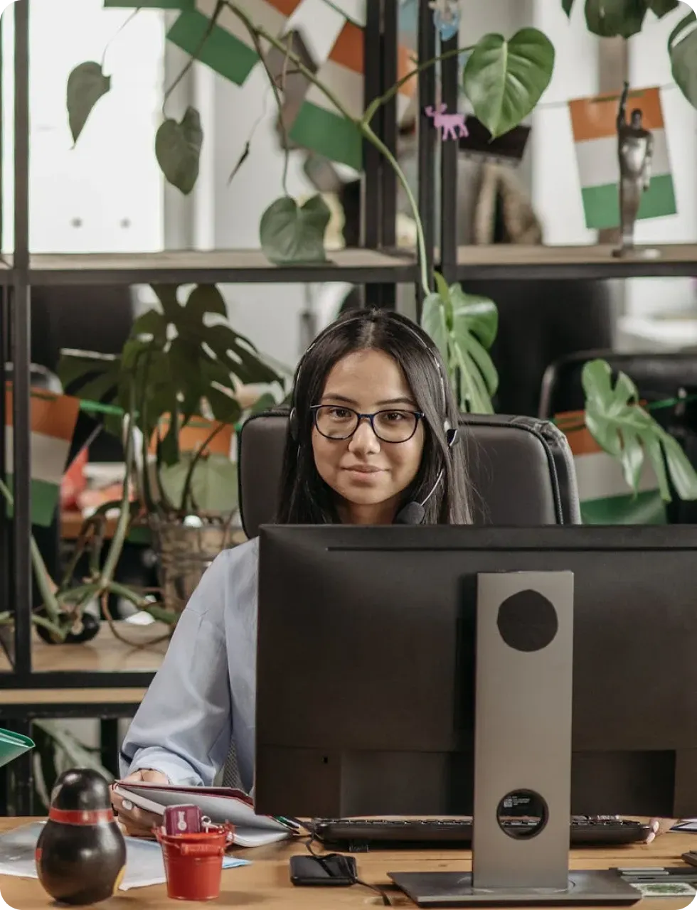 Woman working on business systems at computer for scalable growth