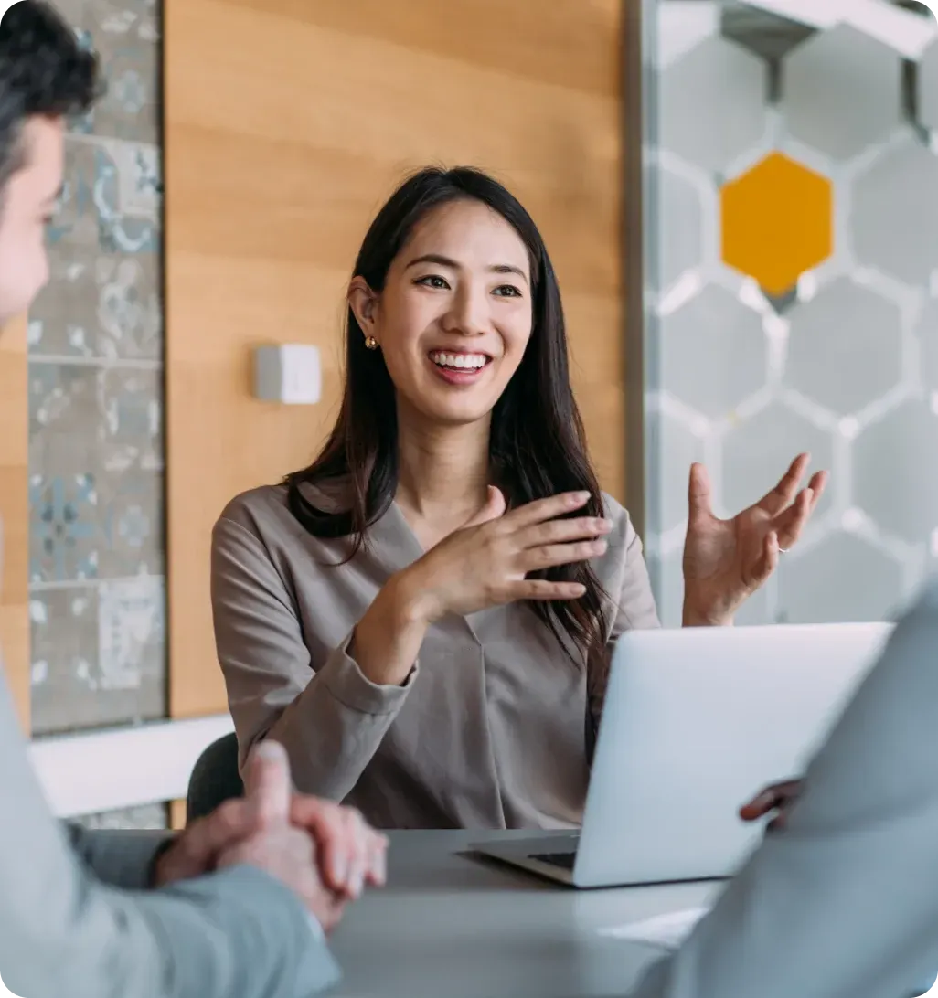 Sales professional presenting ideas during meeting with client in office