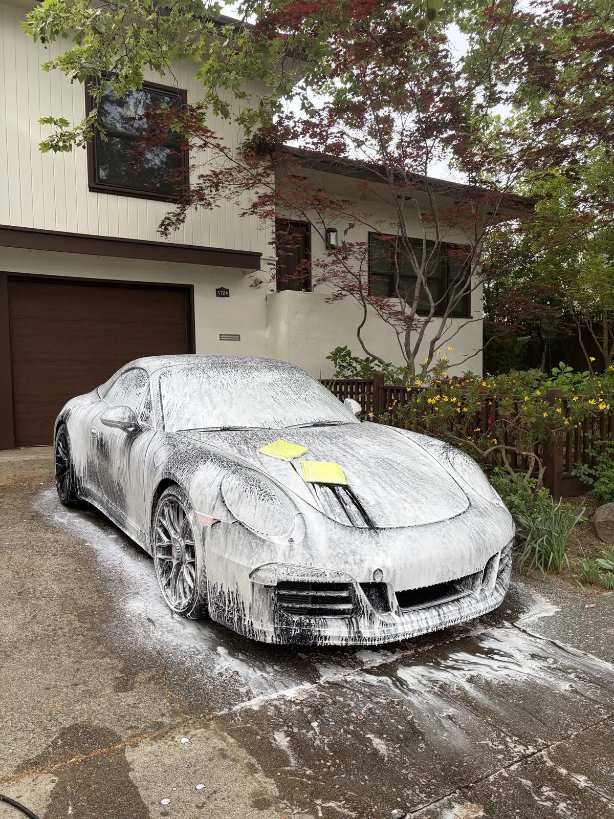 Car being thoroughly hand-washed as part of a professional detailing service in Menlo Park