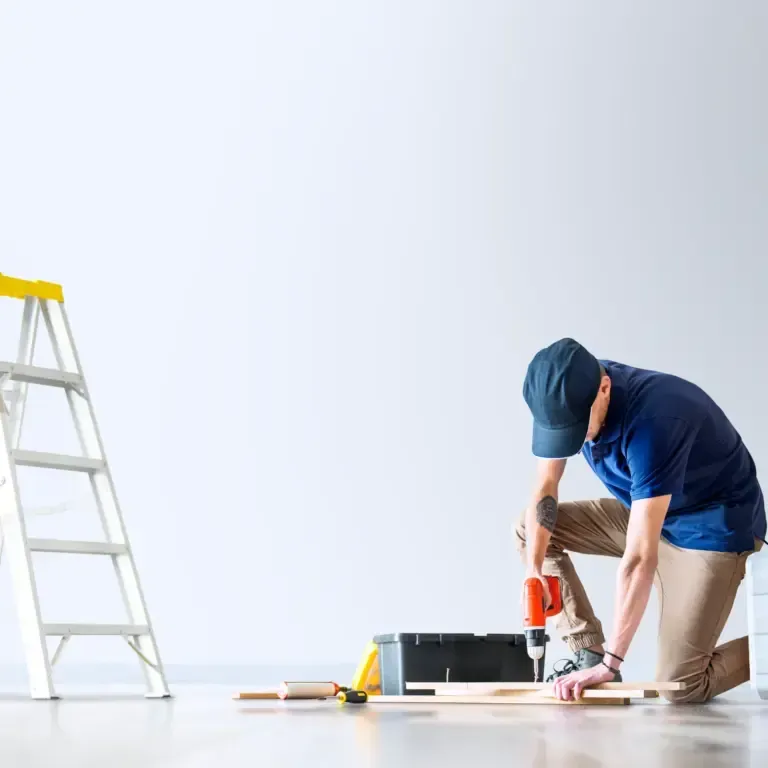 Professional carpenter using power drill on wooden boards – expert carpentry and woodworking services in Australia