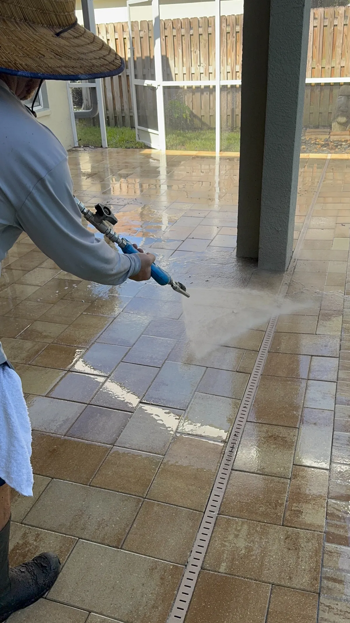 Revive Crew Applying Sealer To Concrete Pavers