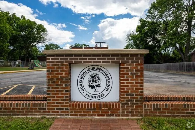 Custom cedar deck with period-style railing in Rountree