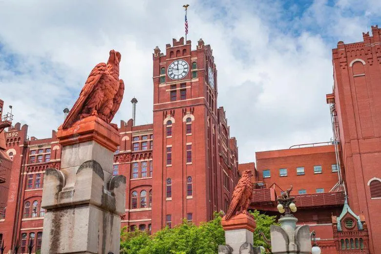 Small cedar deck with black rail on Soulard brick home