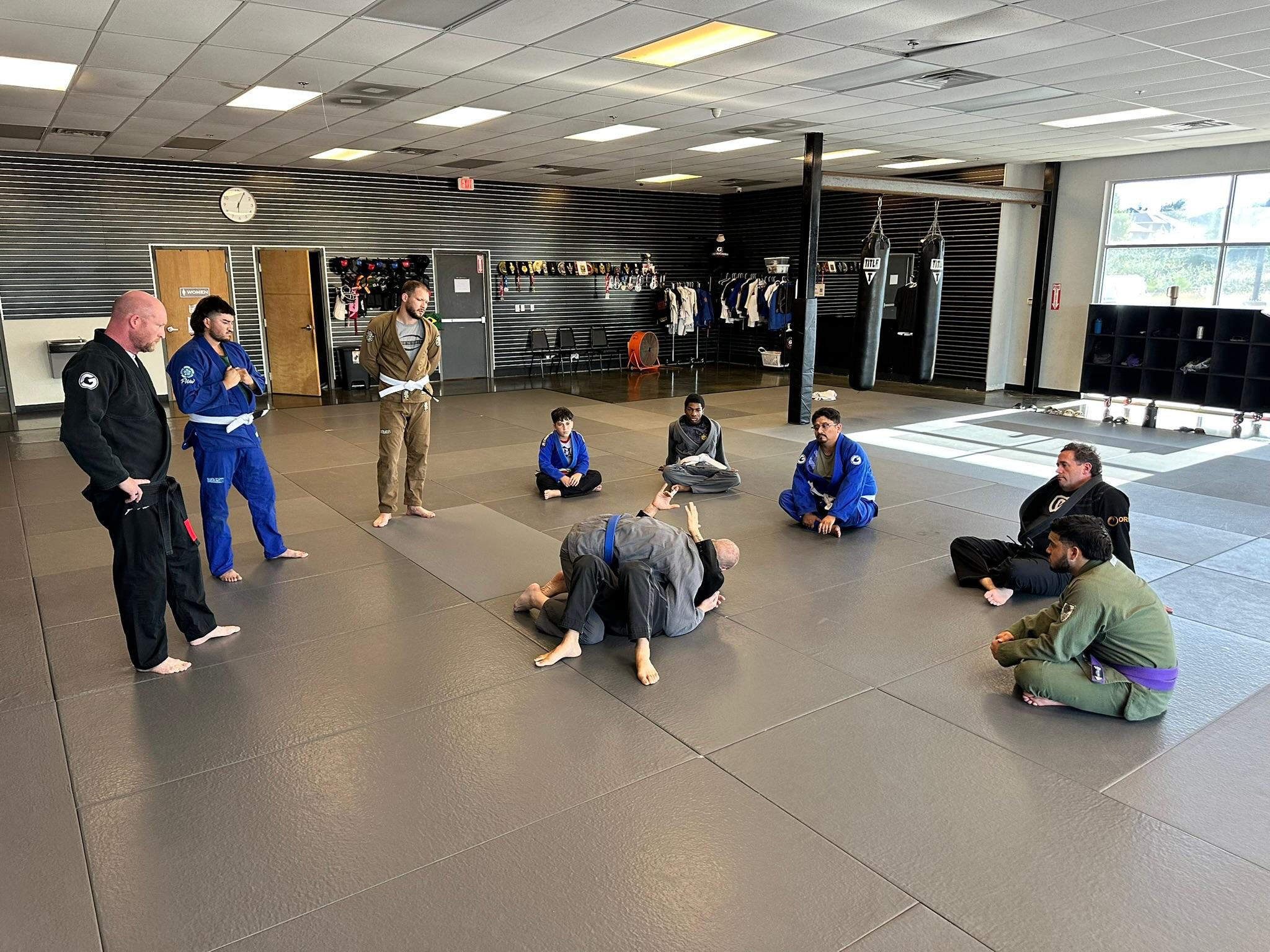 Coach working with a student at Genesis Jiu-Jitsu Burleson