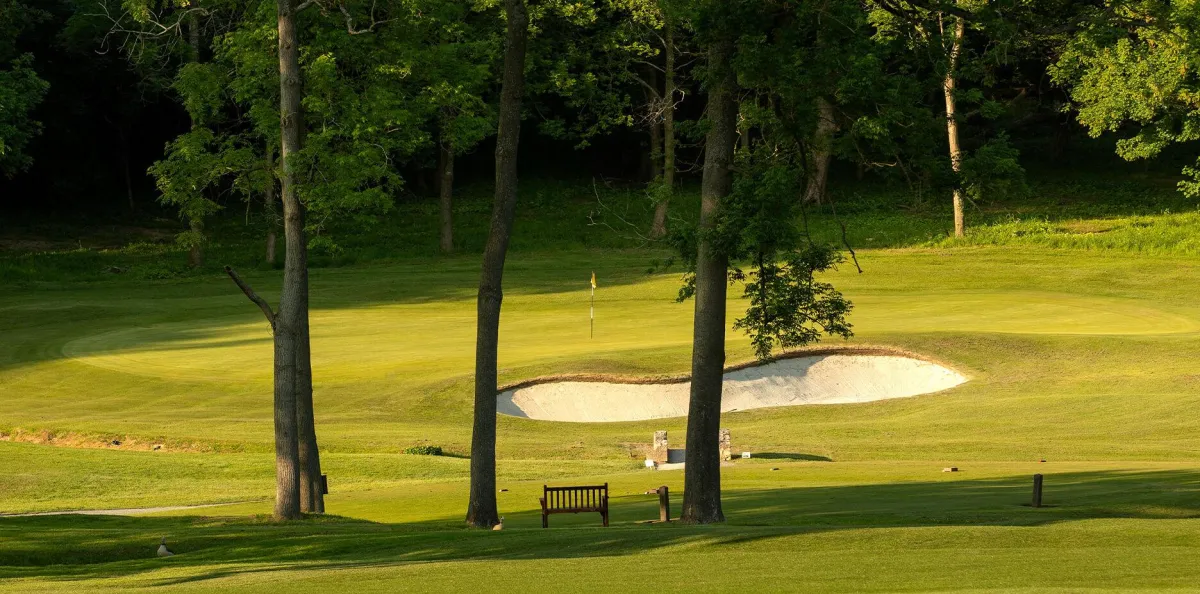 golf course near body of water