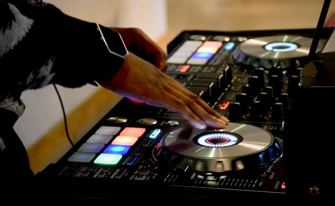 Professional DJ mixing music on a high-end controller at a wedding or event – live entertainment by Dynamic Celebrations.