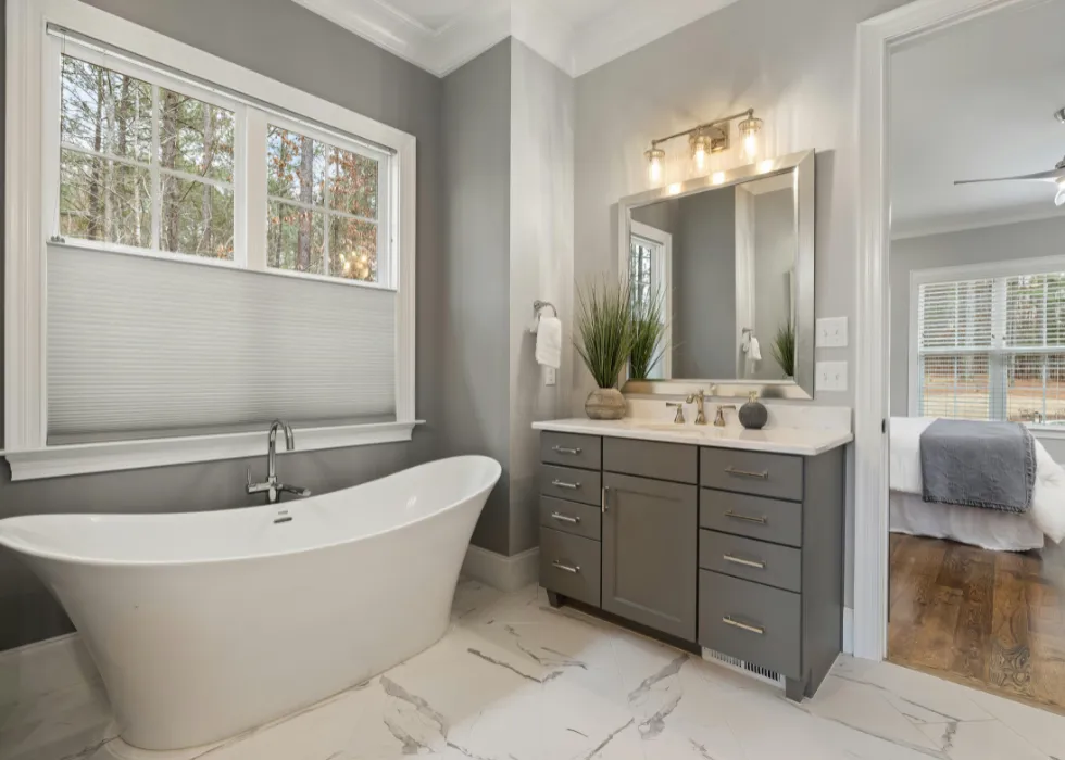 Luxury bathroom remodeling with a freestanding tub, custom vanity, and elegant finishes by Miami Builders.