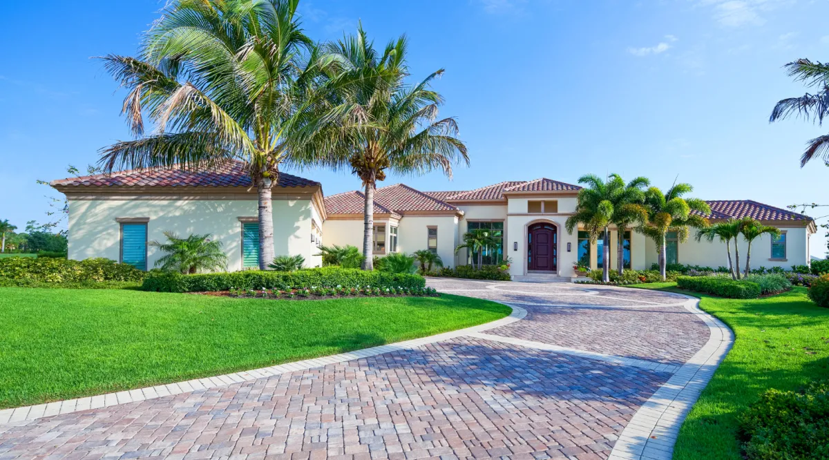 Luxury home featuring a professionally installed tile roof with expert roofing craftsmanship by Miami Builders.