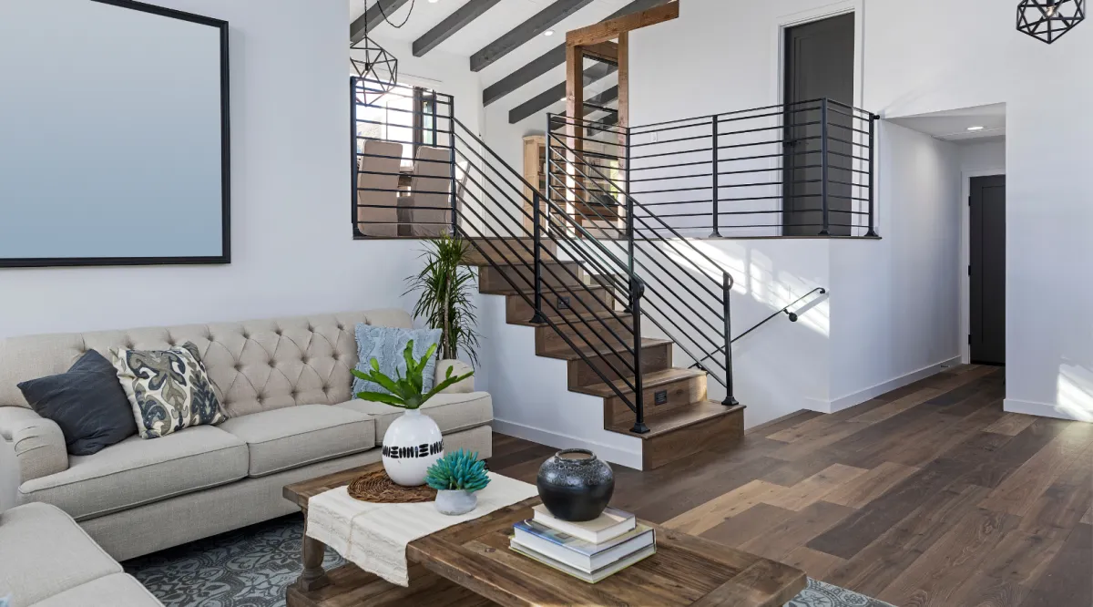 Modern interior home renovation featuring an open staircase, luxury flooring, and open concept living space by Miami Builders.