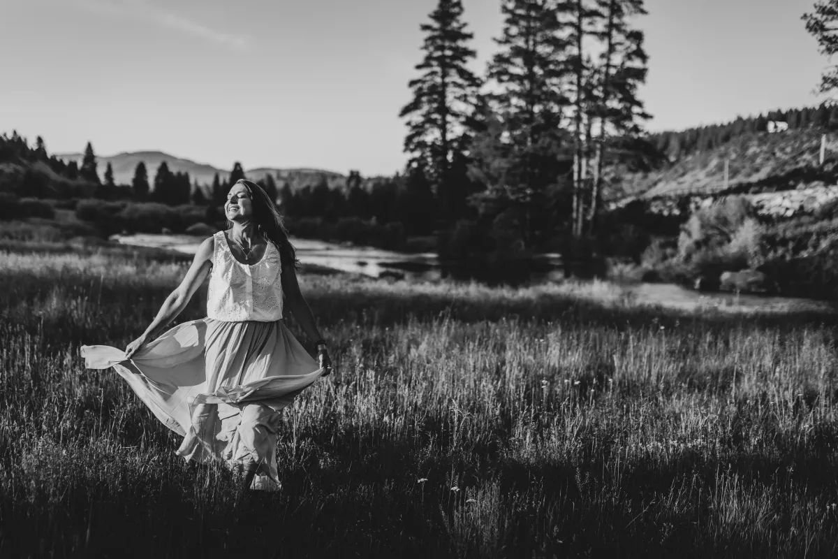 Kaila Leilani in a meadow - From Survival to Freedom webinar