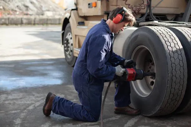 man is doing a fleet tire repair
