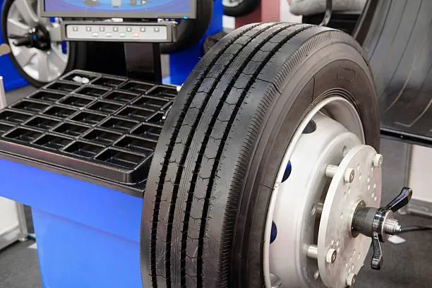 balancing and rotating a commercial tire