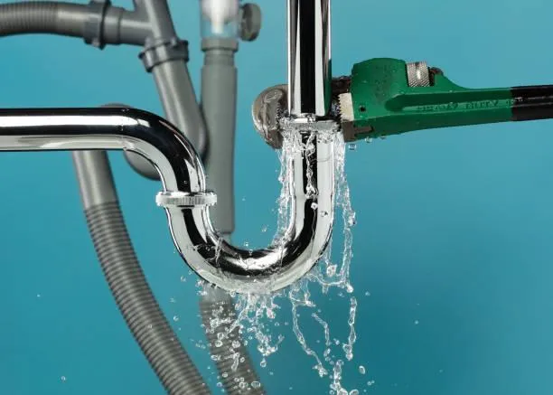 person washing hands on sink