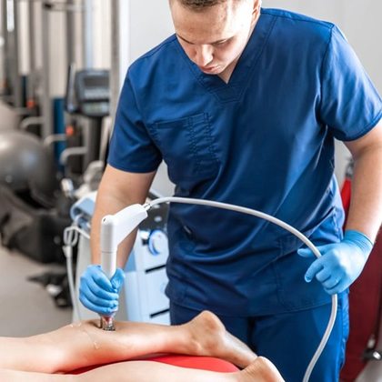 Close-up view of a medical device applied to a patient's knee joint.