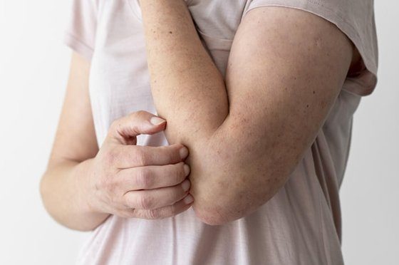 Close-up of hands holding an asthma inhaler.