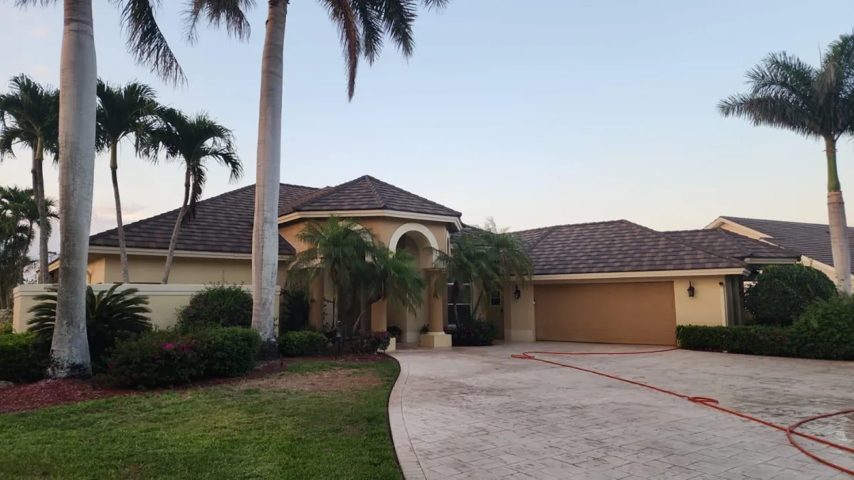 gray wooden house near body of water