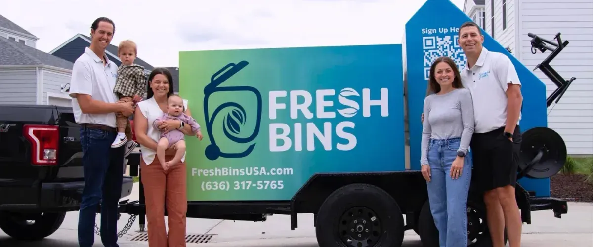 Fresh Bins trash bin cleaning service team standing next to branded service truck.