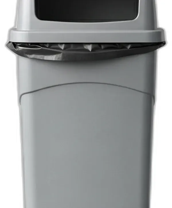 Overflowing trash and recycling bins with bags and cardboard