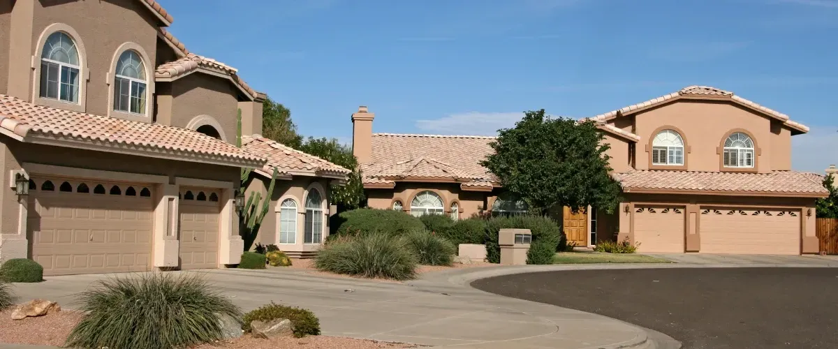 Phoenix residential neighborhood homes with clean driveways and desert landscaping