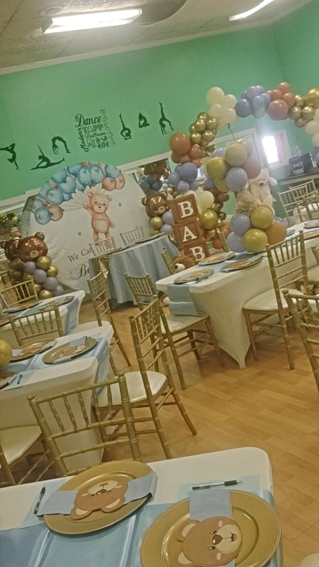 grayscale photography of man and woman hugging near hill