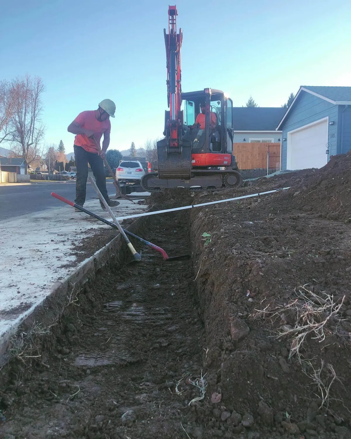 Excavator building a retainer wall in Medford, Oregon