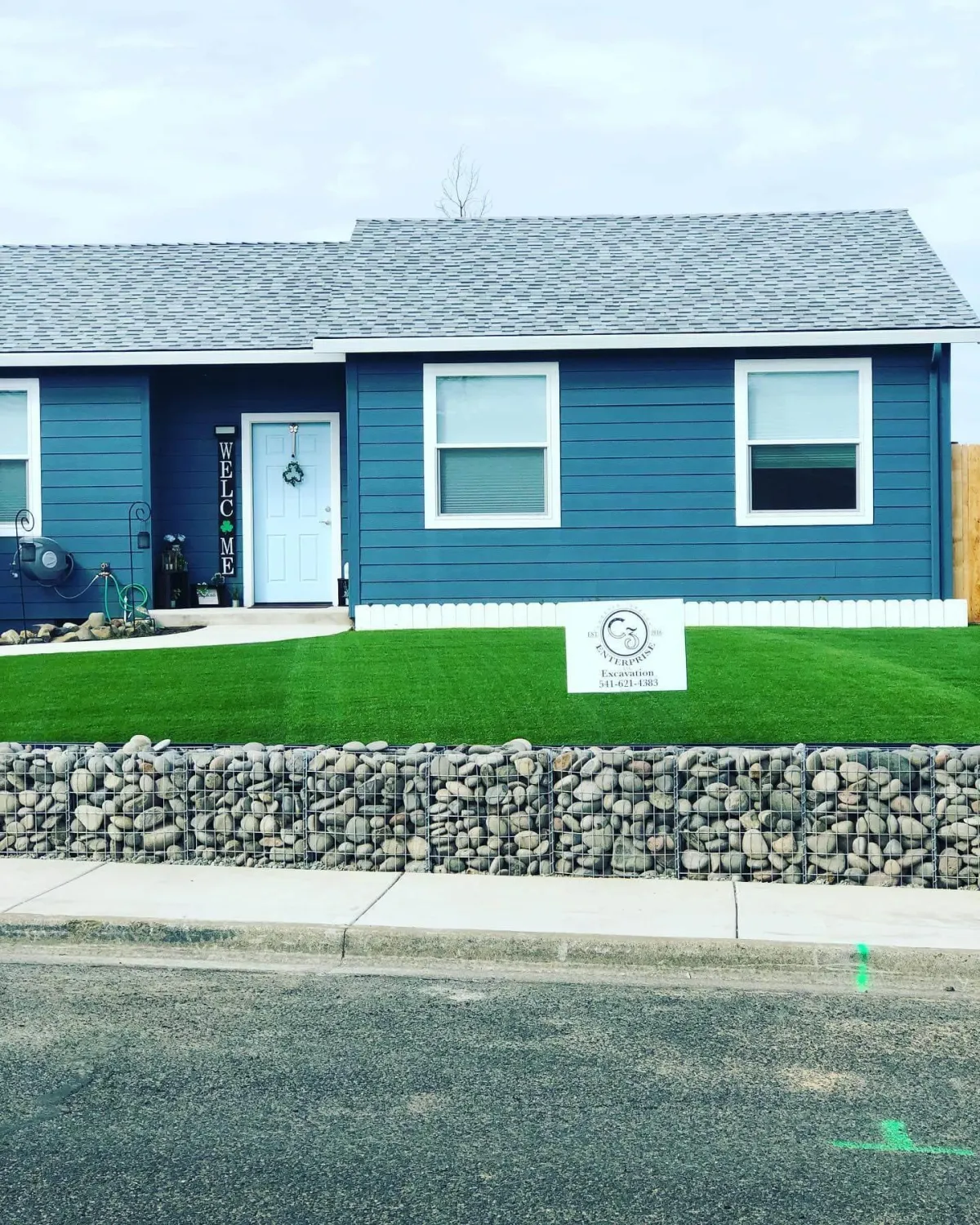 Retainer wall built with an excavator for front yard in Medford, Oregon