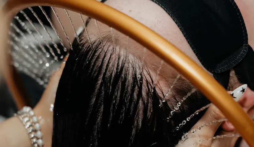 Warm water flowing over a client’s scalp from the halo water feature