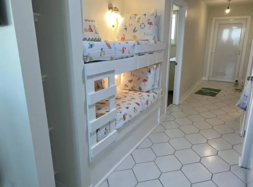 custom bunk beds built into where a closet used o be
