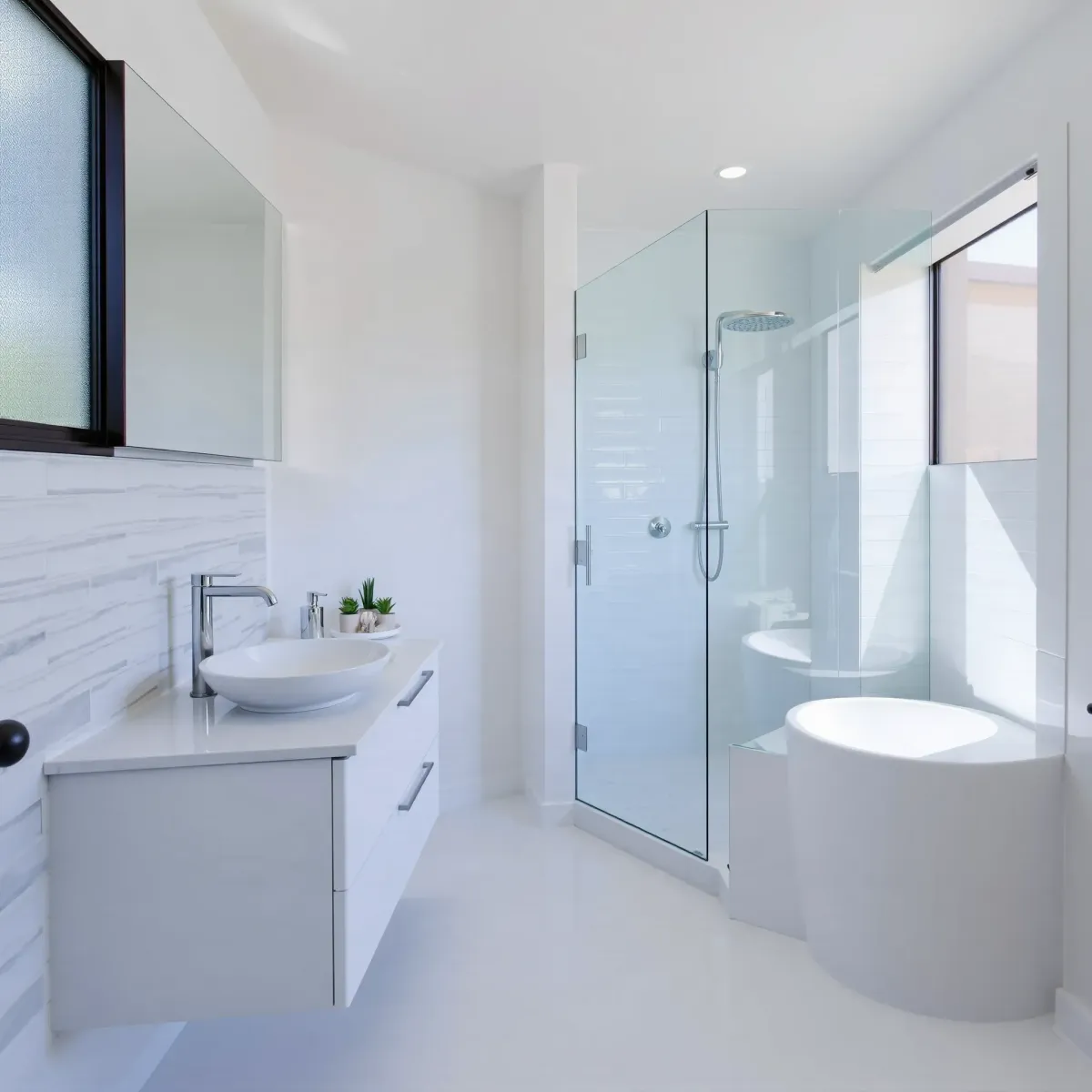 Renovated Manhattan Beach bathroom with marble countertops, glass shower, coastal decor, and modern finishes.