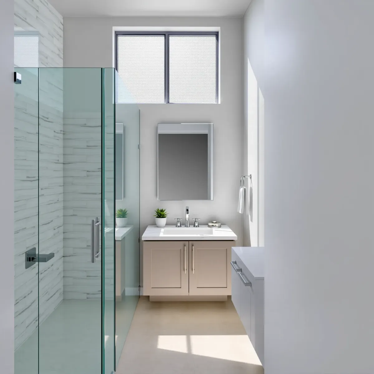 Remodeled West Adams, CA bathroom with sleek design, glass shower, marble vanity, and natural lighting.