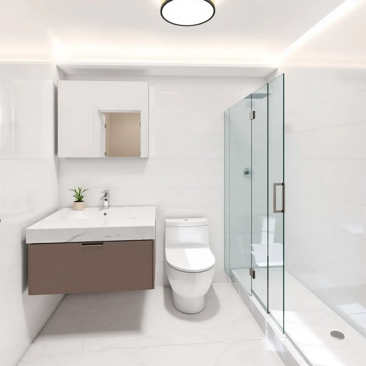 Remodeled small bathroom in Windsor Hills, CA with white ceramic tiles, modern floating vanity, glass shower, and elegant fixtures.