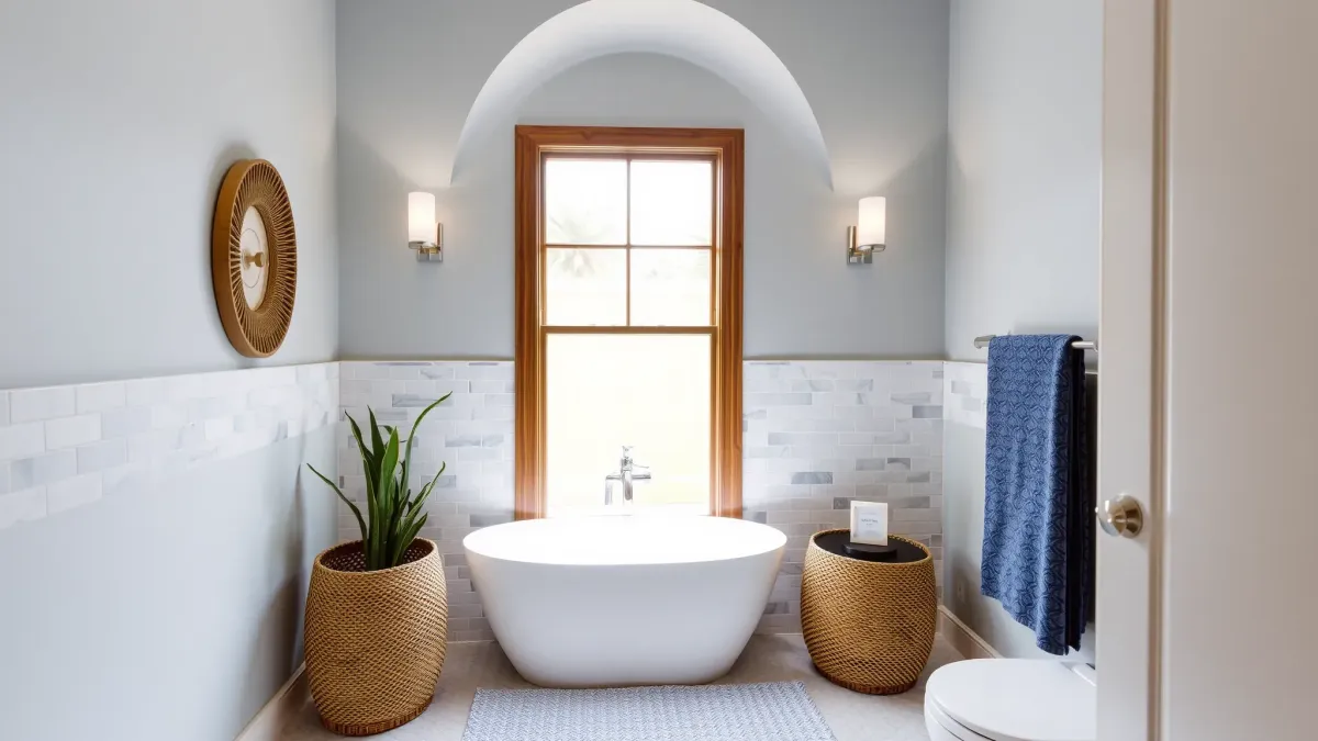 Remodeled Marina del Rey small bathroom with floating vanity, glass shower, ceramic sink, neutral tones, and natural light.