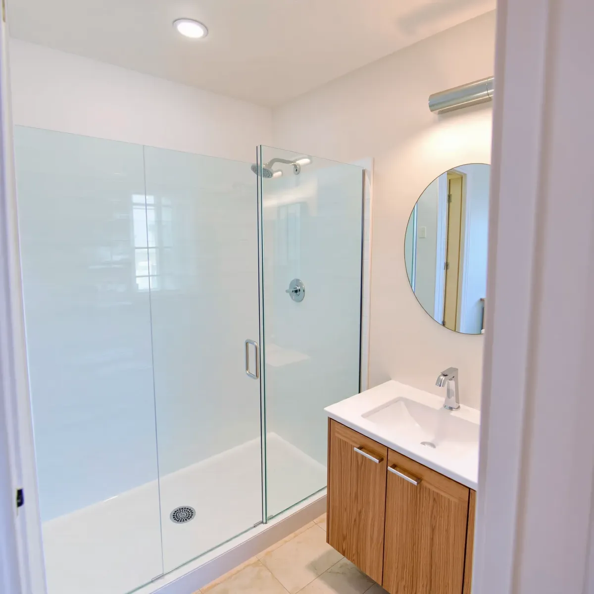 Beautiful renovated small bathroom in Lawndale, CA with modern design, sleek tile, glass shower, and polished accents.