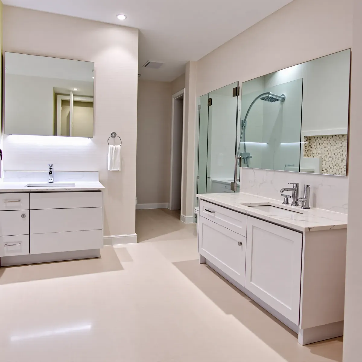 Remodeled Carson, CA bathroom featuring modern fixtures, a freestanding tub, marble shower, granite vanity, and natural lighting.