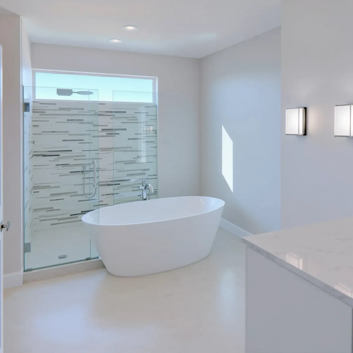 Remodeled Manhattan Beach bathroom with modern fixtures, marble countertops, walk-in shower, coastal decor, and ambient lighting.