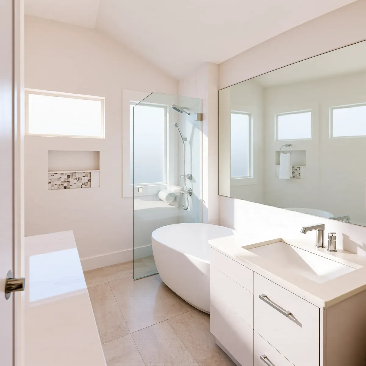 Modern Rancho Park bathroom with marble countertops, glass shower, brushed nickel fixtures, and neutral-toned, stylish design.