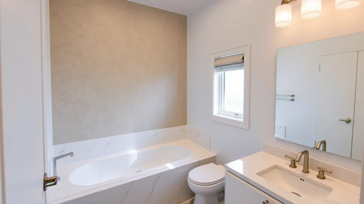 Beautifully renovated Playa del Rey bathroom with modern fixtures, marble countertops, walk-in shower, and coastal decor.