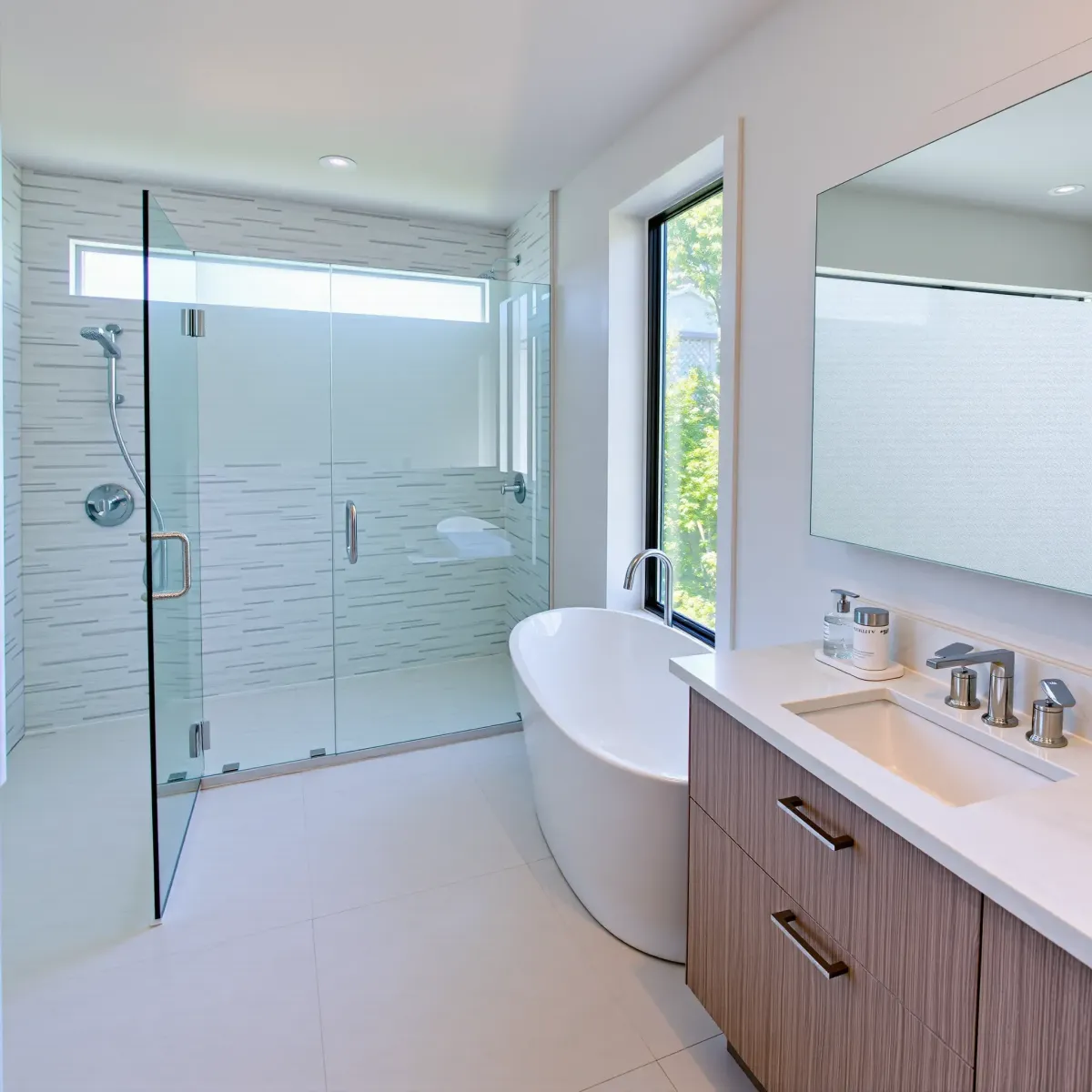 Beautiful renovated Torrance bathroom with modern fixtures, walk-in shower, marble countertops, and natural light.