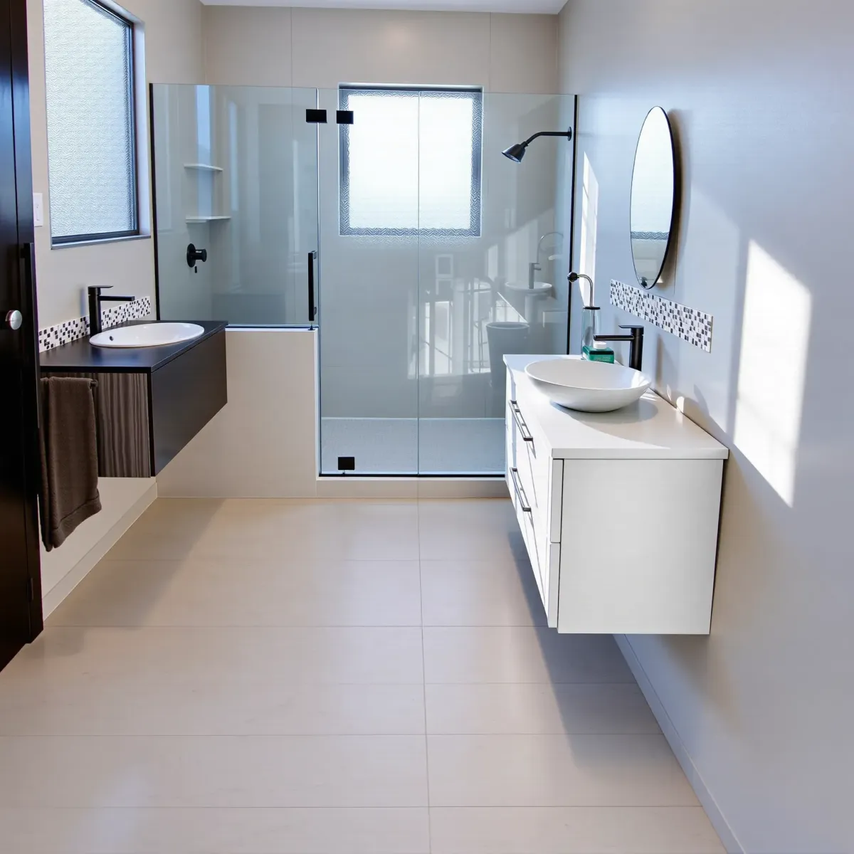 Recently remodeled small bathroom in Hawthorne, CA featuring a glass shower, white vanity, ceramic tiles, and natural light.