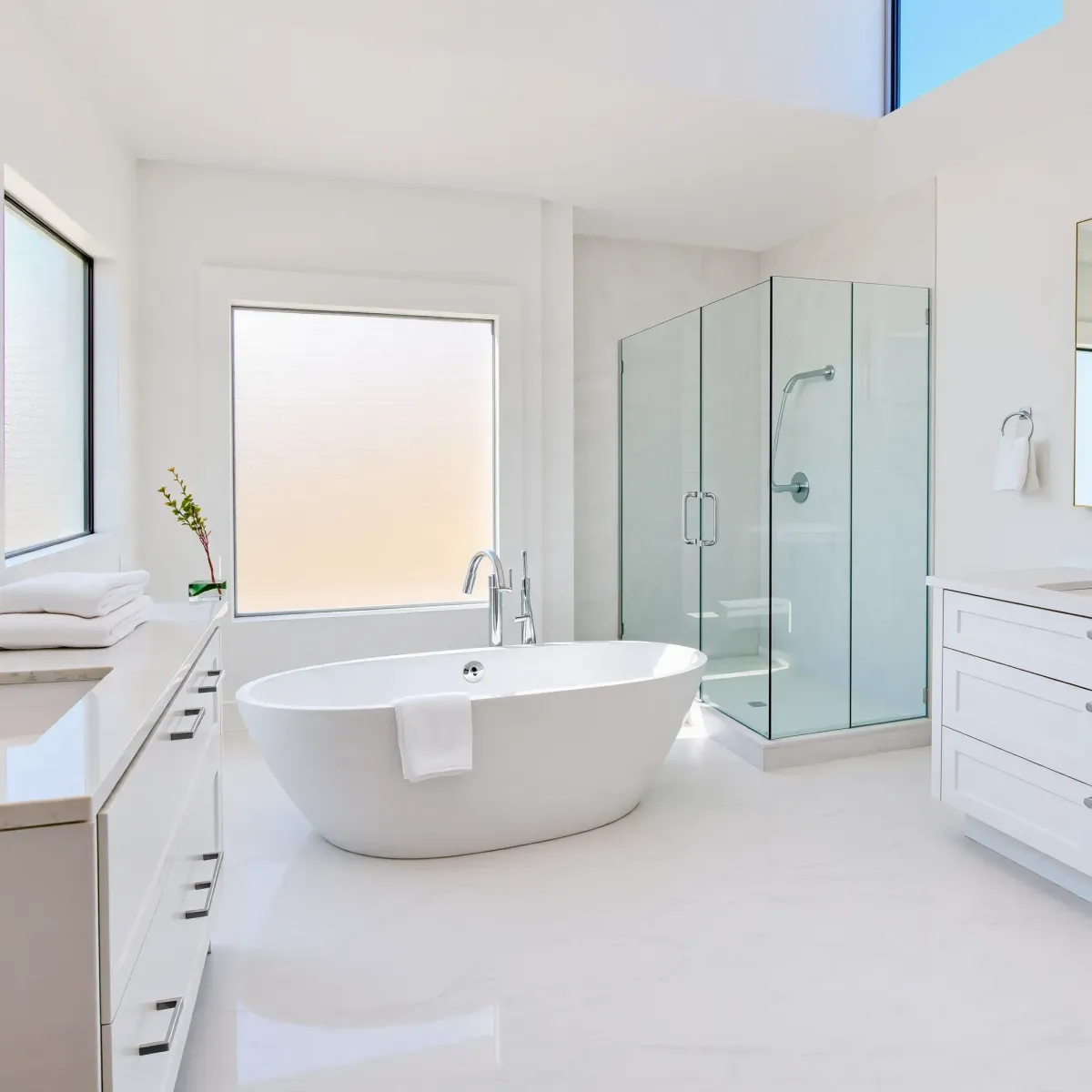 Modern bathroom with sleek tiles, a glass shower enclosure, stylish fixtures, and contemporary decor in View Park, CA.