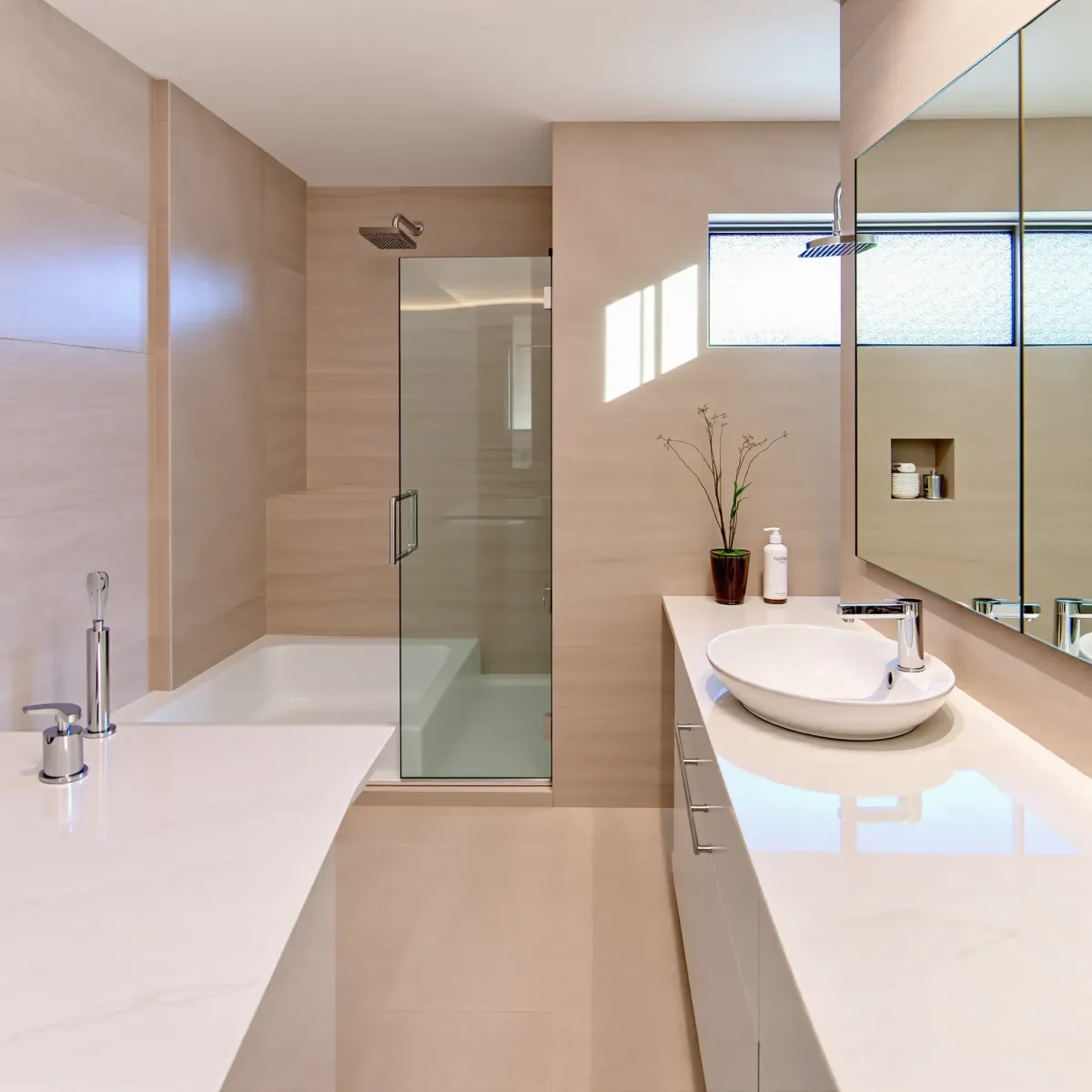 Small Windsor Hills bathroom remodel with sleek fixtures, quartz countertops, neutral tiles, walk-in shower, and modern decor.