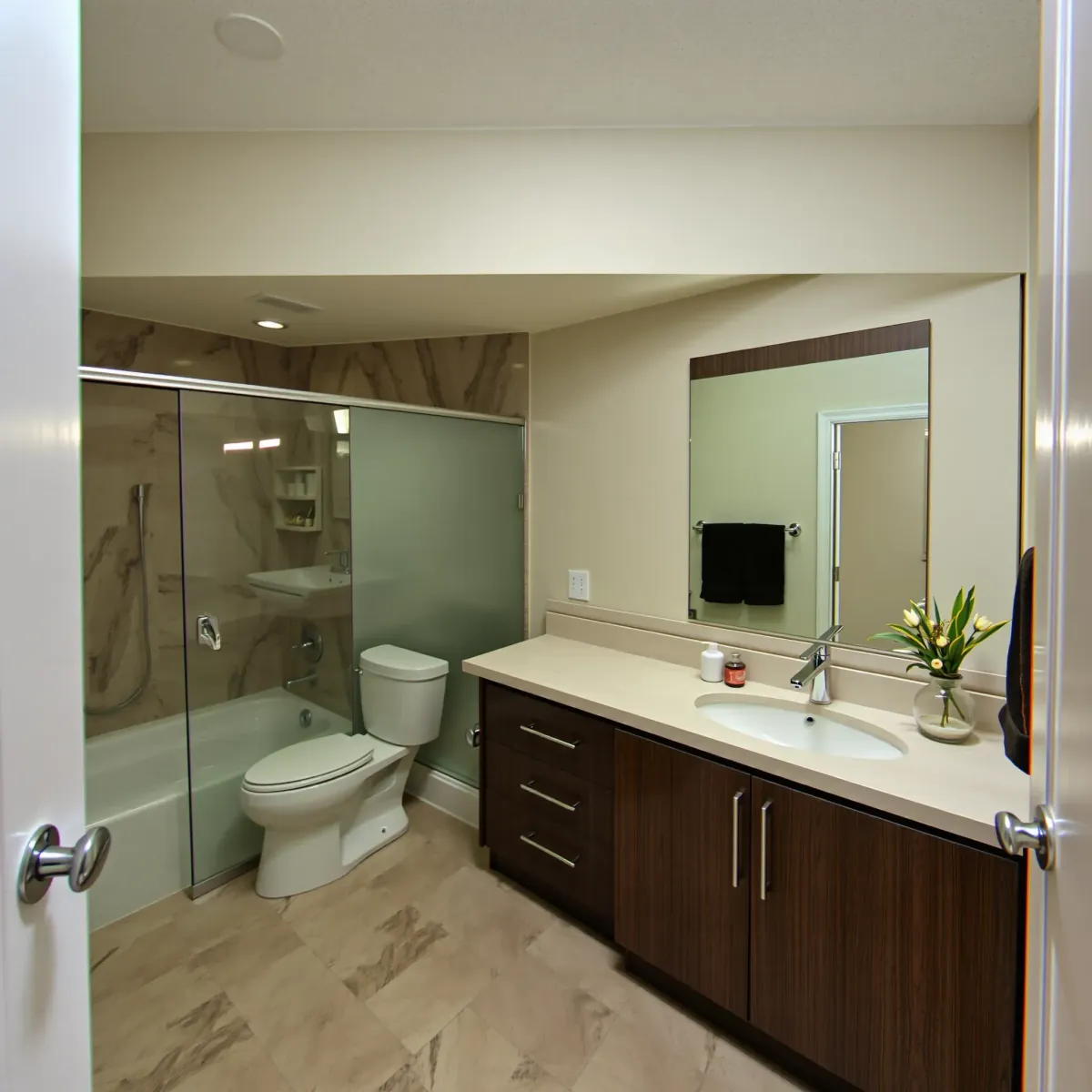 Beautiful renovated Gardena bathroom with modern fixtures, walk-in shower, marble countertops, and elegant decor.