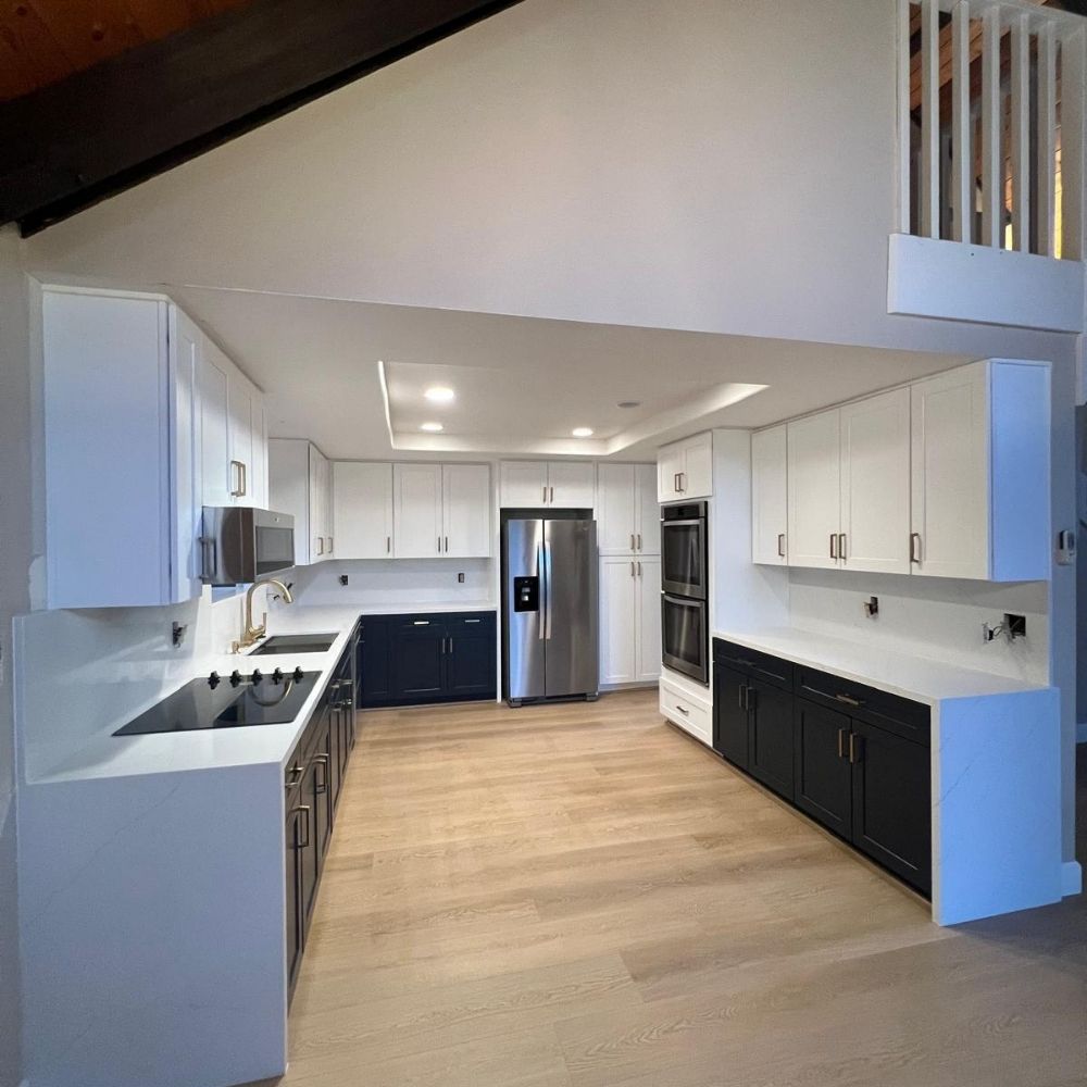 Large custom kitchen remodel with dual-tone cabinetry, expansive layout, and modern finishes