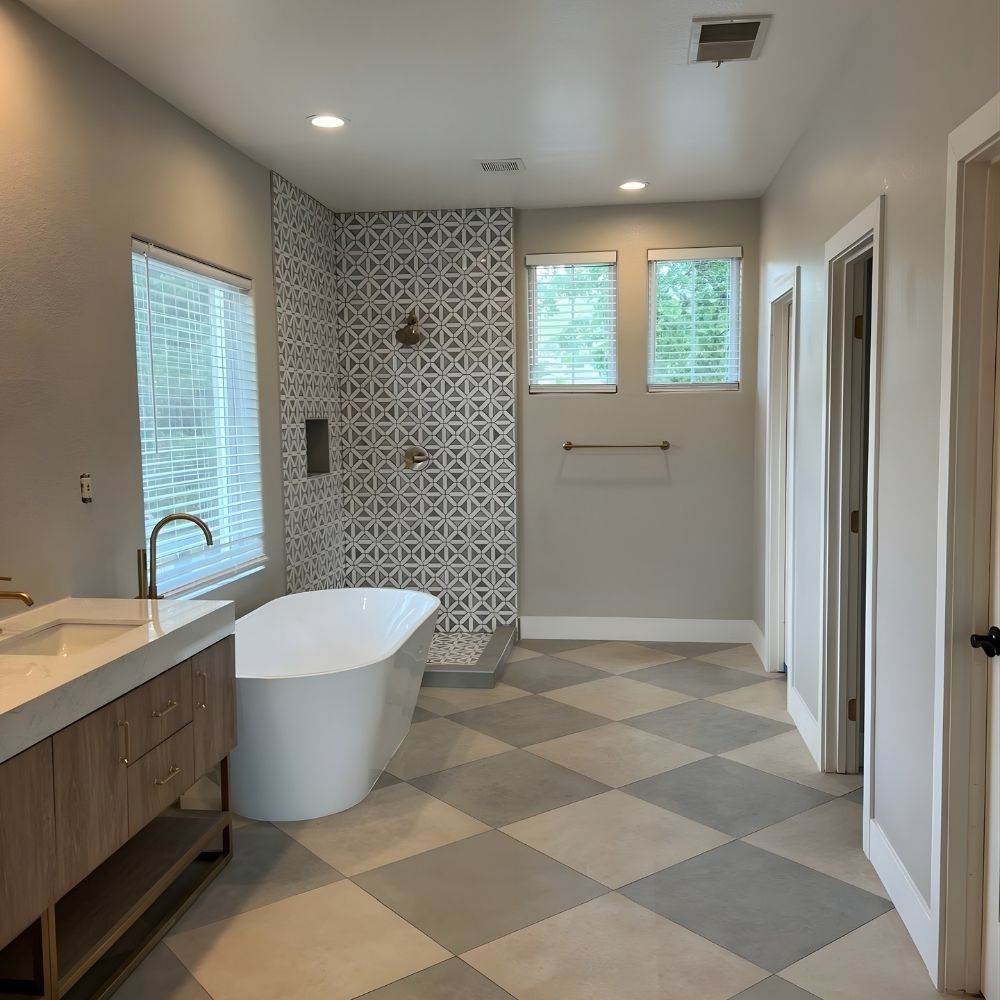 Bright bathroom renovation with tiled shower, freestanding tub, and modern vanity layout