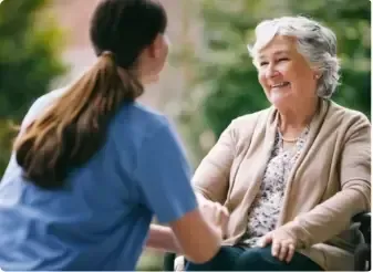An Axia Office representative consulting with an elderly woman at a Sydney aged care facility.