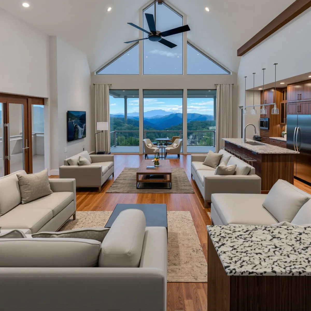 Beautiful renovated Pigeon Forge living room with modern cozy decor, hardwood floors, large windows, mountain views, and elegant furnishings.